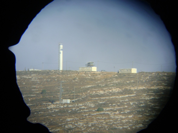 Outpost Hill 777 through binoculars. Photo EAPPI/C. Schelbert, 2012.