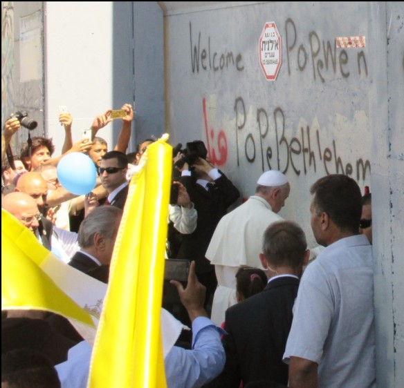 The Pope steps down from his vehicle to say a prayer at the separation wall in Bethlehem. Photo EAPPI/E. Mutschler.