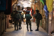 05.09.15. Hebron, Old City. Soldiers patrolling the souq during Settlers Tour. Photo EAPPI/R. Leme