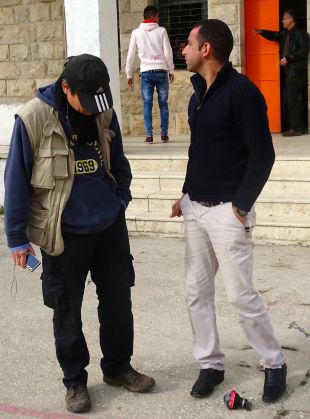 21.02.16 Al Khader Teacher shows EA a teargas canister shot into school yard, EAPPI/TA. Prois