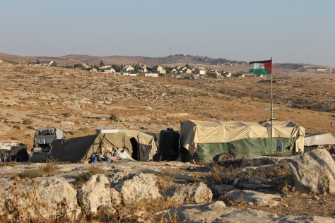 Susiya village with settlement in the background. Photo EAPPI/ L.l. Pianezza 28.6.2015 -