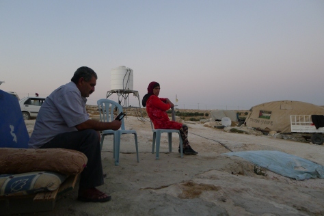 Susiya august 2016 Jihad, head of the village and his sister sitting in front of family tent - photo EAPPISHH